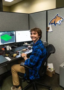 Hunter, an engineering intern, works with a CAD program to design a tool