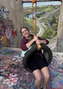 Janie sitting on tire swing