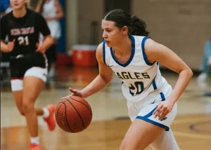 Jordan dribbling a basketball during a college game