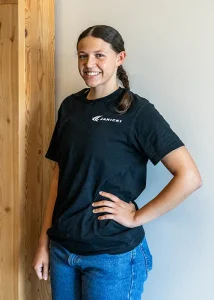 Jordan poses for photo with black Janicki t-shirt on