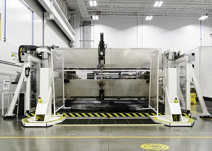A Matec flatbed NDI scanner shoots water at a test panel