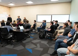 2025 Interns listen to a presentation by previous interns 