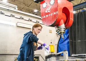 Becky cleans the mill's ficture