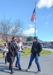 Michael Janicki, COO, and Thomas Janicki walk alongside Idaho Lt. Gov. Bedke