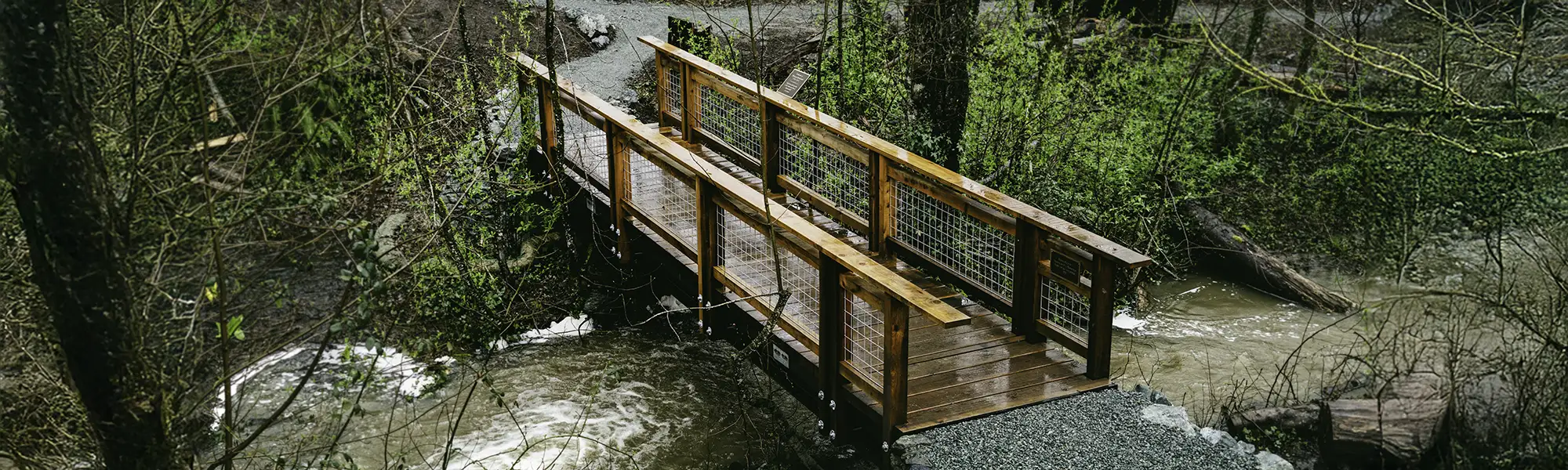 A wooden bridge across Brickyard Creek in Olmsted Park in Sedro-Woolley, WA.