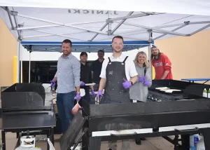 Utah employees cook cinco de mayo lunch posing for camera
