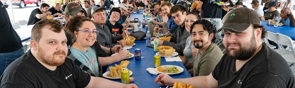 Employees enjoy cinco de mayo luncheon at table in Washington