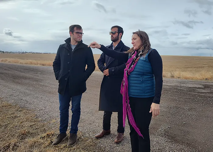 From left: Thomas Janicki, Michael Janicki, COO of Janicki, and Jolene Schalper, executive vice president of the Great Falls Development Alliance, tour the AgriTech Park site.