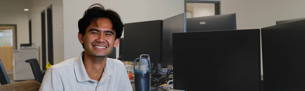 Evan at his desk