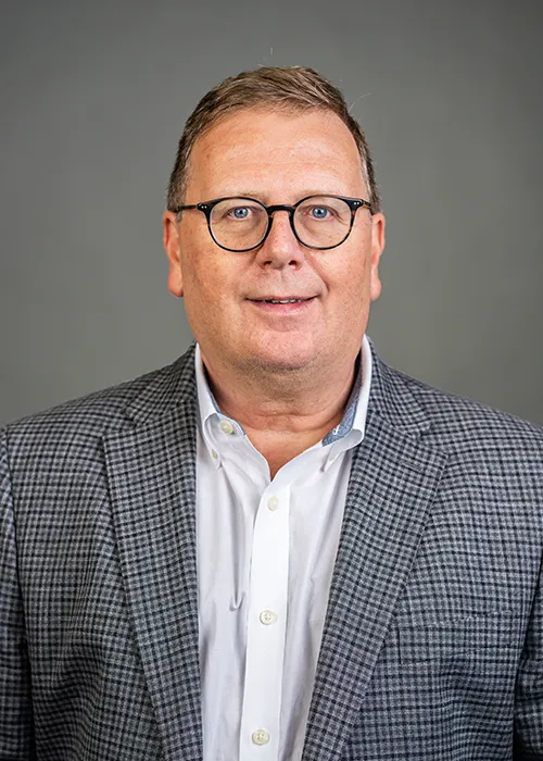 Richard Taylor, Chief Accounting Officer, smiles directly at the camera for a headshot.