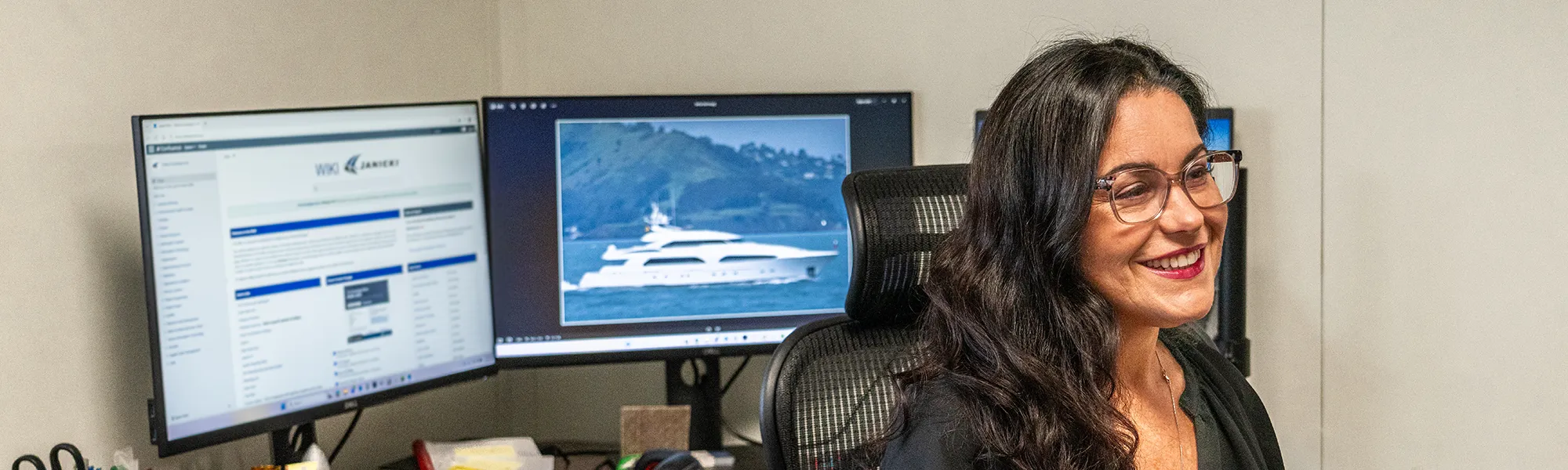 Sheena program administrator, sits at her desk